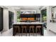 Modern kitchen featuring dark cabinetry, a large center island, and stainless steel appliances at 819 Belgrade Ne Ave, Atlanta, GA 30306