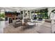 Open concept with modern decor, sleek furniture, and expansive windows overlooking the backyard at 819 Belgrade Ne Ave, Atlanta, GA 30306