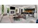 Spacious living room featuring a fireplace, modern furniture, and an open layout connecting to the kitchen at 819 Belgrade Ne Ave, Atlanta, GA 30306