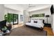 Spacious main bedroom features hardwood floors, a platform bed, and access to the outdoors at 819 Belgrade Ne Ave, Atlanta, GA 30306