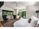 Bright main bedroom with large windows, sleek decor, and stylish seating area for relaxation at 819 Belgrade Ne Ave, Atlanta, GA 30306