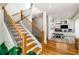 Open floor plan with a modern wood staircase and a view of the exercise room at 819 Belgrade Ne Ave, Atlanta, GA 30306