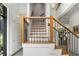 Beautiful staircase with modern railings and wood accents, providing a stylish transition between levels at 819 Belgrade Ne Ave, Atlanta, GA 30306