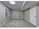 Finished basement featuring neutral carpeting, ample natural light from window, and access to other rooms at 1400 Scenic Brook Sw Trl, Conyers, GA 30094