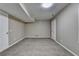 Finished basement with neutral walls and carpet, featuring access to another room at 1400 Scenic Brook Sw Trl, Conyers, GA 30094