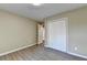 Bedroom with wooden flooring and closet at 1400 Scenic Brook Sw Trl, Conyers, GA 30094