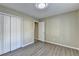 Bedroom with wooden flooring and closet at 1400 Scenic Brook Sw Trl, Conyers, GA 30094