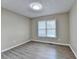 Bedroom with wooden flooring and natural light at 1400 Scenic Brook Sw Trl, Conyers, GA 30094