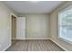 Bedroom with wooden flooring and natural light at 1400 Scenic Brook Sw Trl, Conyers, GA 30094