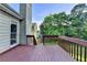 Spacious outdoor deck with views of the serene backyard and lush greenery at 1400 Scenic Brook Sw Trl, Conyers, GA 30094