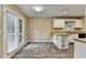 Bright kitchen with white cabinets, granite counters and stainless steel appliances at 1400 Scenic Brook Sw Trl, Conyers, GA 30094
