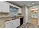 Well-lit kitchen featuring granite countertops, stainless steel appliances, and ample cabinet space at 1400 Scenic Brook Sw Trl, Conyers, GA 30094