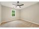 Comfortable bedroom with a ceiling fan and soft carpet provides a blank canvas for personalization at 1911 Woodmont Ct, Marietta, GA 30062