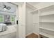 Walk-in closet with built-in shelving and ample storage space at 1911 Woodmont Ct, Marietta, GA 30062