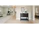 Inviting foyer with light wood floors, decorative table, and access to multiple rooms at 1911 Woodmont Ct, Marietta, GA 30062