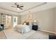 Spacious main bedroom with a tray ceiling and a walk-in closet at 1911 Woodmont Ct, Marietta, GA 30062