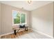 Cozy room with hardwood floors and a window with natural light at 1911 Woodmont Ct, Marietta, GA 30062