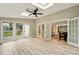 Bright sunroom with skylights, French doors, and durable wood-look flooring at 1911 Woodmont Ct, Marietta, GA 30062