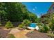 Lush backyard with a swimming pool and beautiful landscaping; ideal for outdoor entertaining at 200 Glenview Ct, Woodstock, GA 30188