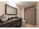 Bathroom featuring granite countertops, a large mirror, tile floors, and a shower with curtain at 200 Glenview Ct, Woodstock, GA 30188