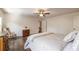 Bright bedroom featuring hardwood floors, traditional furnishings, a ceiling fan, and neutral color scheme at 200 Glenview Ct, Woodstock, GA 30188