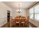 Bright dining room features hardwood floors, detailed trim, and a modern chandelier at 200 Glenview Ct, Woodstock, GA 30188