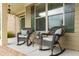 Inviting front porch with comfortable rocking chairs, perfect for relaxing outdoors at 200 Glenview Ct, Woodstock, GA 30188