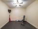 Home gym with rubber flooring and fitness equipment, including a weight bench and dumbbells at 200 Glenview Ct, Woodstock, GA 30188
