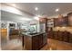 Open kitchen concept with granite island, stainless steel appliances, and view to living area at 200 Glenview Ct, Woodstock, GA 30188