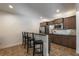 Finished basement features a bar and kitchenette with stainless steel appliances and dark wood cabinetry at 200 Glenview Ct, Woodstock, GA 30188