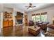 Spacious living room with fireplace, built-ins, and large windows bringing in natural light at 200 Glenview Ct, Woodstock, GA 30188
