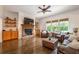 Cozy living room with a stone fireplace and hardwood floors at 200 Glenview Ct, Woodstock, GA 30188