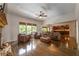 Cozy living room with hardwood floors, stone fireplace, and open access to the kitchen at 200 Glenview Ct, Woodstock, GA 30188