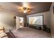 Entertainment room featuring large projector screen, ceiling fan and door that enters another room at 200 Glenview Ct, Woodstock, GA 30188
