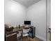 Small, functional home office space with a desk, computer, and storage shelves at 200 Glenview Ct, Woodstock, GA 30188