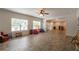 Large finished basement playroom features two large windows and access to the bar and hallway at 200 Glenview Ct, Woodstock, GA 30188