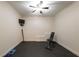 Clean workout room with black rubber floor and ceiling fan with space for a home gym at 200 Glenview Ct, Woodstock, GA 30188