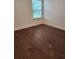 Bright bedroom with hardwood floors and a window offering plenty of natural light at 2949 Longbush, Duluth, GA 30097