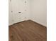 Spacious bedroom with hardwood flooring and modern double closet at 2949 Longbush, Duluth, GA 30097