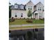 Classic two-story home with a light brick facade, large windows, and a green lawn at 2949 Longbush, Duluth, GA 30097