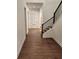 Bright hallway with hardwood floors, a staircase, and natural light from a window in the door at 2949 Longbush, Duluth, GA 30097