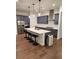 Modern kitchen with stainless steel appliances, a spacious island with seating and blue cabinets at 2949 Longbush, Duluth, GA 30097