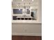 Open kitchen with large island, modern pendant lighting, stainless steel appliances, and blue cabinetry at 2949 Longbush, Duluth, GA 30097