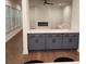 Open-concept living room with modern fireplace, hardwood floors and large windows at 2949 Longbush, Duluth, GA 30097