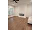 Contemporary living room with sleek fireplace, hardwood floors, white walls and modern sofa at 2949 Longbush, Duluth, GA 30097