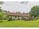 Manicured backyard featuring a lush lawn and a deck perfect for outdoor relaxation and entertainment at 3333 Old Salem Se Rd, Conyers, GA 30013