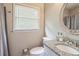 Bright bathroom featuring granite countertop with sink and brushed nickel faucet with an oval mirror at 3333 Old Salem Se Rd, Conyers, GA 30013