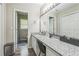 Bathroom with long granite countertop and sink, with an open doorway to a commode at 3333 Old Salem Se Rd, Conyers, GA 30013