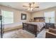 Inviting bedroom with plush carpet, ceiling fan, and a well-coordinated decor creates a relaxing retreat for rest and rejuvenation at 3333 Old Salem Se Rd, Conyers, GA 30013