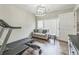 Versatile bonus room featuring wood floors, neutral paint and a seating area at 3333 Old Salem Se Rd, Conyers, GA 30013